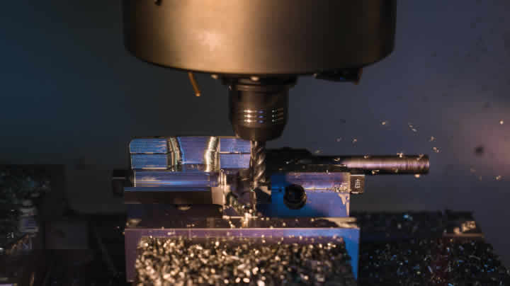 Milling machine shaping a putter